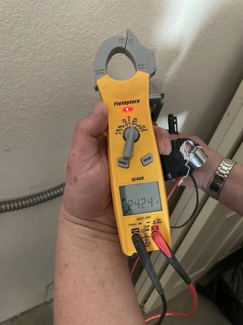 Voltage testing with clamp meter during Electrical Installation Services in Salem